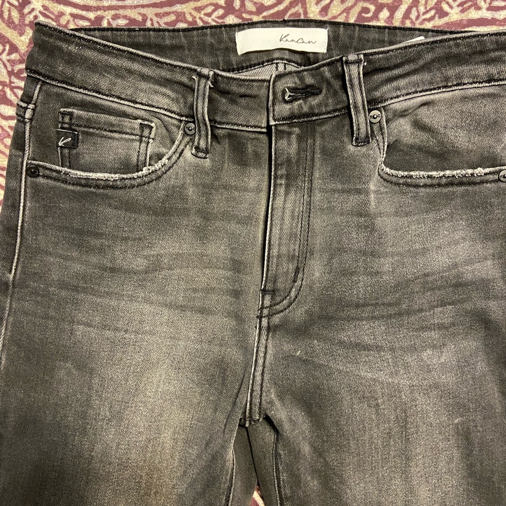 KanCan washed black jeans with frayed accents.
